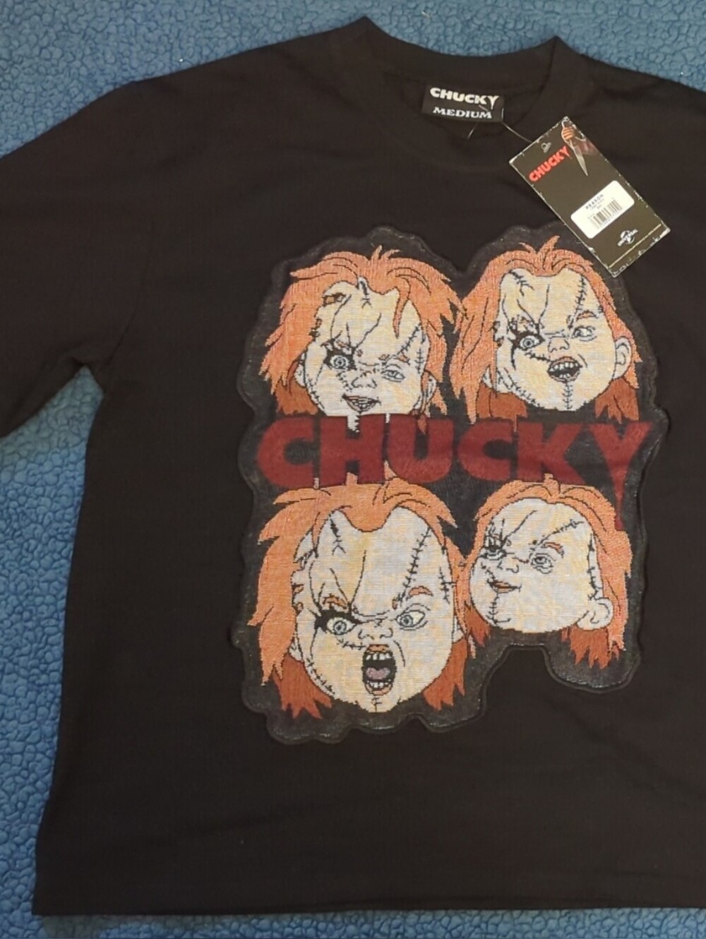 Universal Reason Black Chucky Graphic Tee with Orange Hair Accents